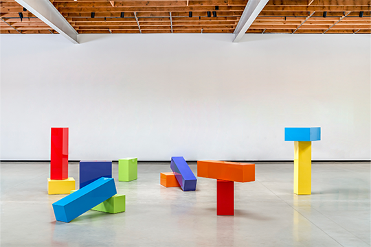 large multicolored blocks in the middle of an empty room