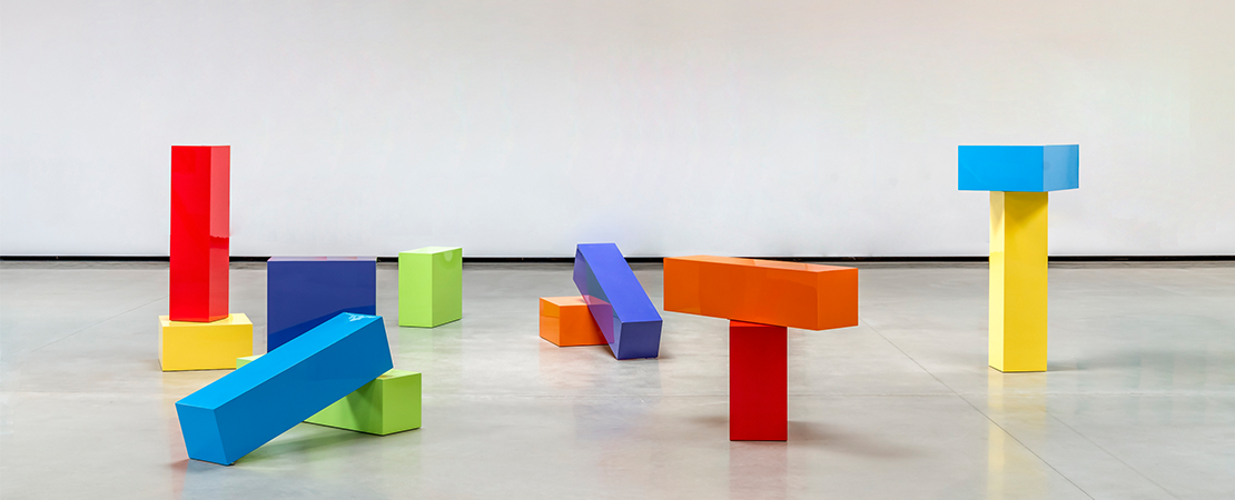 large multicolored blocks in the middle of an empty room