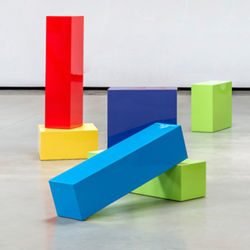 Sculpture made from brightly colored rectangular blocks stacked at various angles Sculpture made from brightly colored rectangular blocks stacked at various angles