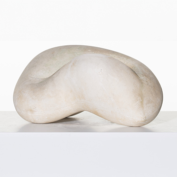 Creamy white plaster sculpture with an organic form resembling a bean.