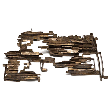 Bronze sculpture made of small flat planes arranged to resemble a rocky landscape.