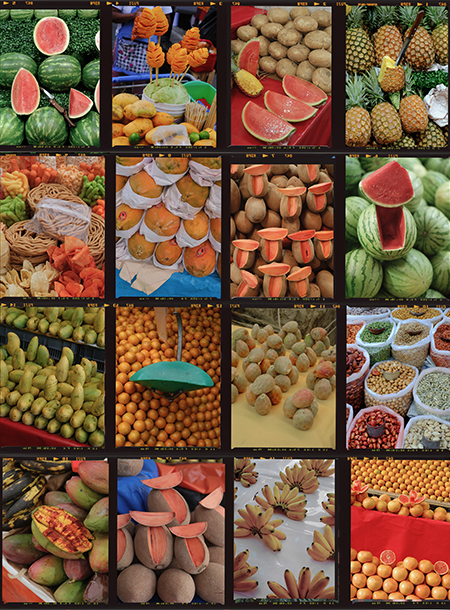 market stall in mexico of fruits including watermelon, pineapple, canteloupe